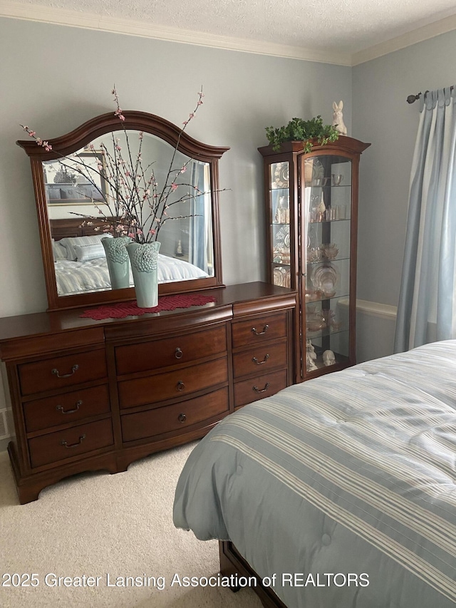 4001 Canyon Cv # 56, Holt, MI 48842 - bedroom featuring light colored carpet, a textured ceiling, and ornamental molding