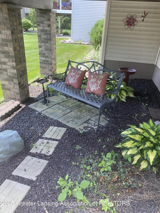 4001 Canyon Cv # 56, Holt, MI 48842 - view of grassy yard featuring a patio