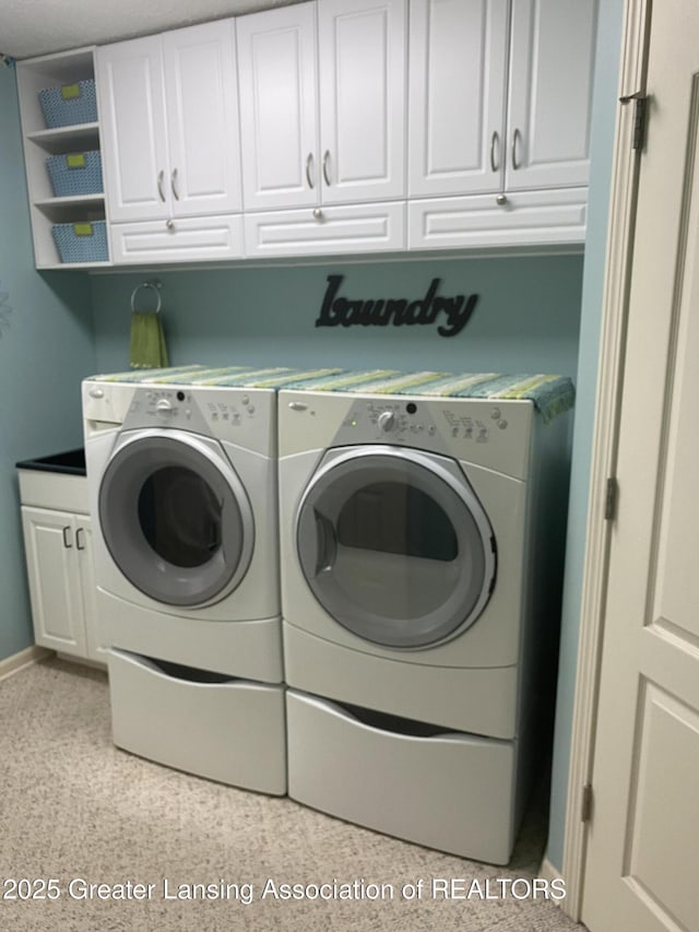 4001 Canyon Cv # 56, Holt, MI 48842 - laundry area with cabinet space and washing machine and dryer