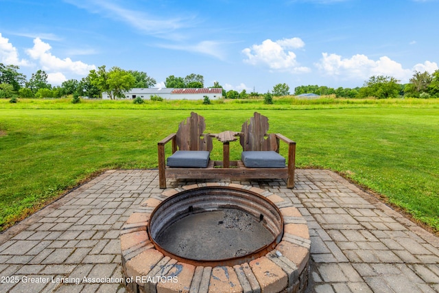 14747 Forest Hill Rd, Grand Ledge, MI 48837 - view of patio / terrace with an outdoor fire pit