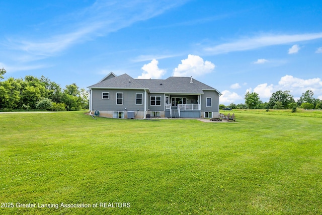 14747 Forest Hill Rd, Grand Ledge, MI 48837 - back of property with a yard and a fire pit