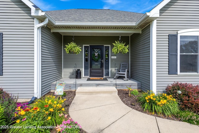 14747 Forest Hill Rd, Grand Ledge, MI 48837 - property entrance featuring a porch and a shingled roof