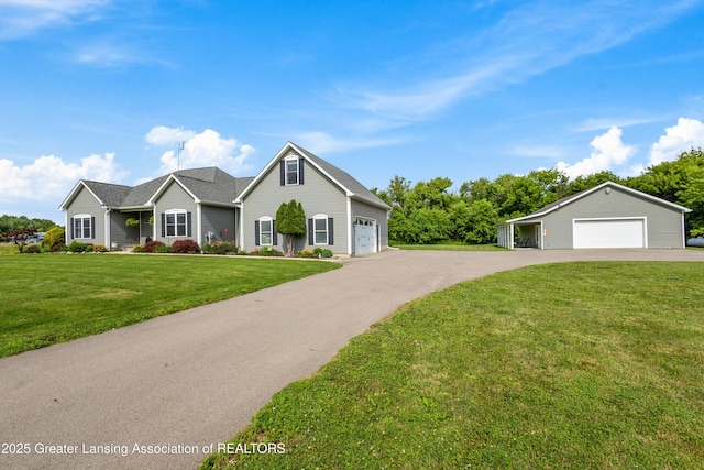 14747 Forest Hill Rd, Grand Ledge, MI 48837 - traditional-style house featuring a front lawn and a garage