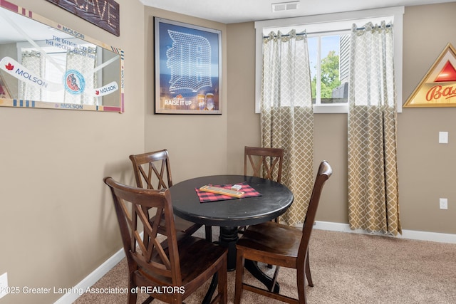 14747 Forest Hill Rd, Grand Ledge, MI 48837 - dining area with carpet floors and baseboards