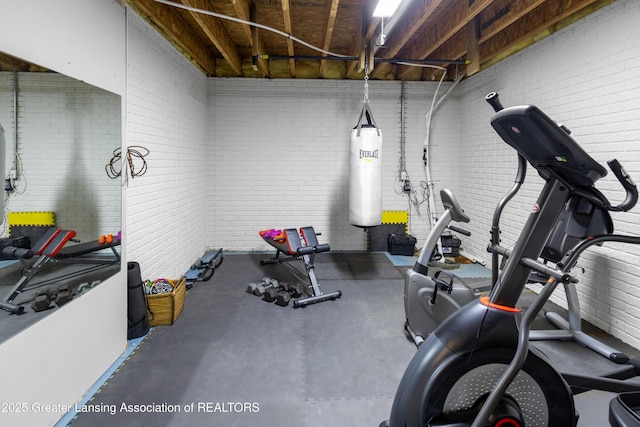 14747 Forest Hill Rd, Grand Ledge, MI 48837 - workout room featuring brick wall