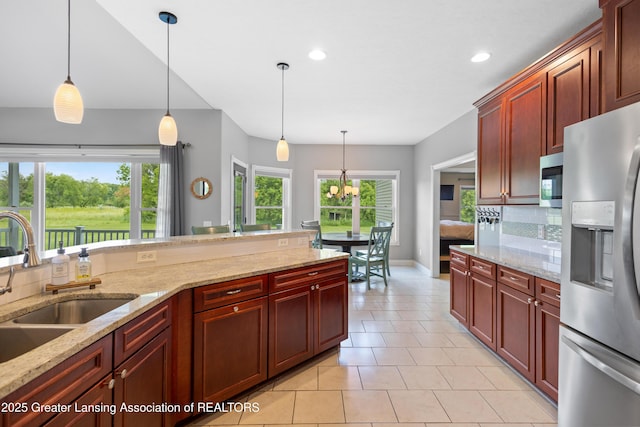 14747 Forest Hill Rd, Grand Ledge, MI 48837 - kitchen with appliances with stainless steel finishes, decorative light fixtures, tasteful backsplash, recessed lighting, and light tile patterned flooring