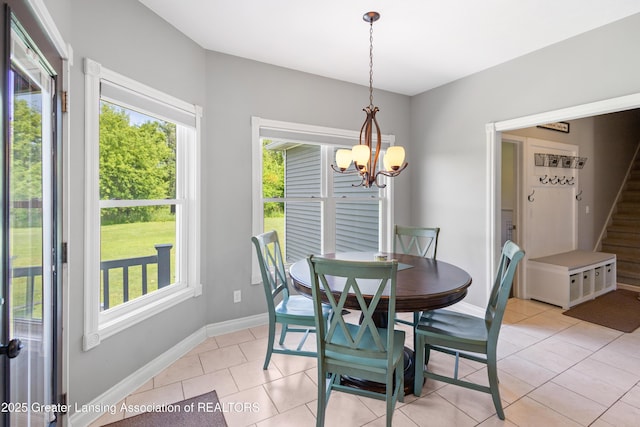 14747 Forest Hill Rd, Grand Ledge, MI 48837 - dining room featuring a chandelier, stairway, and light tile patterned floors