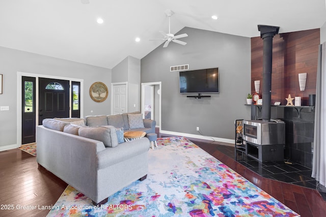 14747 Forest Hill Rd, Grand Ledge, MI 48837 - living room featuring ceiling fan, high vaulted ceiling, a wood stove, wood finished floors, and recessed lighting