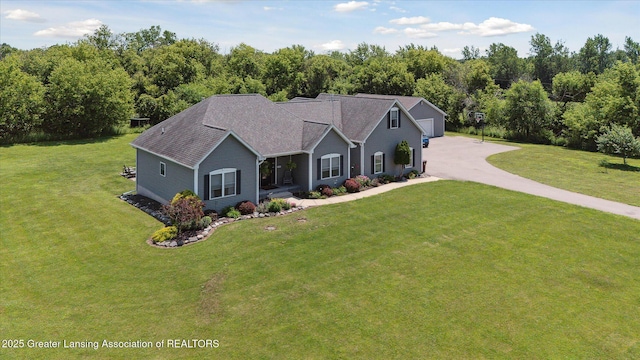 14747 Forest Hill Rd, Grand Ledge, MI 48837 - view of front of home featuring a front yard, a garage, and driveway