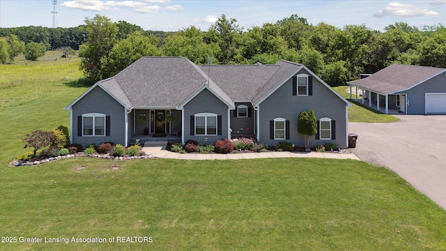 14747 Forest Hill Rd, Grand Ledge, MI 48837 - view of front of property with a porch and a front lawn