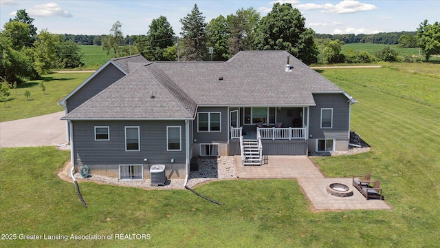 14747 Forest Hill Rd, Grand Ledge, MI 48837 - back of house featuring an outdoor fire pit, a patio area, stairway, and a yard