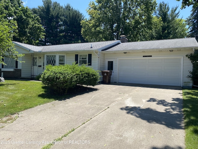 3931 Berry Ridge Dr, Holt, MI 48842 - single story home with driveway, a garage, a front lawn, a chimney, and a shingled roof
