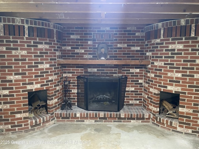3931 Berry Ridge Dr, Holt, MI 48842 - detailed view of a brick fireplace and concrete flooring