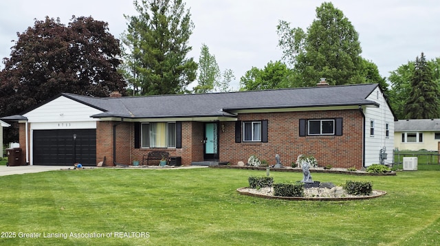 8713 Wintergreen St, Lansing, MI 48917 - ranch-style home featuring brick siding, a garage, a front yard, concrete driveway, and roof with shingles