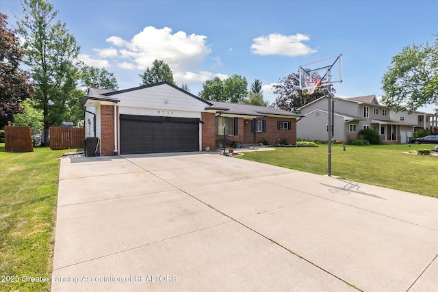 8713 Wintergreen St, Lansing, MI 48917 - ranch-style house featuring a garage, brick siding, and concrete driveway