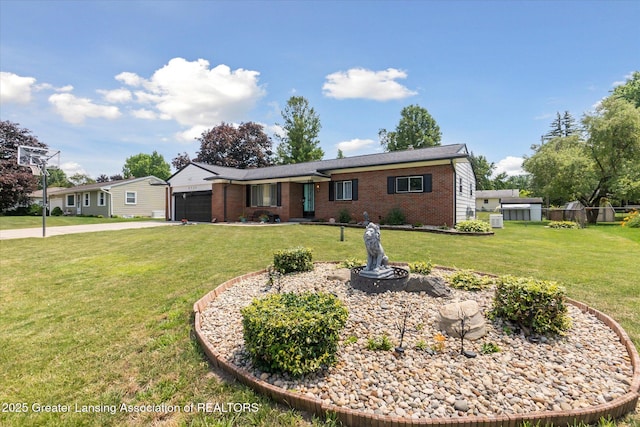 8713 Wintergreen St, Lansing, MI 48917 - ranch-style house featuring brick siding, a garage, a front lawn, and driveway