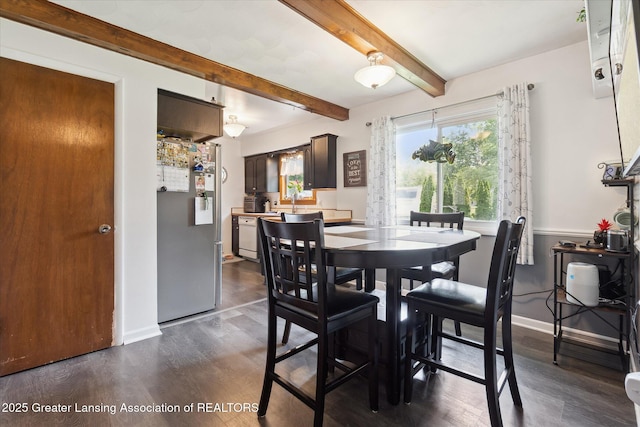8713 Wintergreen St, Lansing, MI 48917 - dining space with dark wood finished floors and beamed ceiling