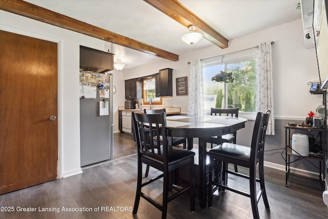 8713 Wintergreen St, Lansing, MI 48917 - dining area with dark wood finished floors and beamed ceiling