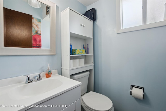 8713 Wintergreen St, Lansing, MI 48917 - bathroom featuring toilet and vanity