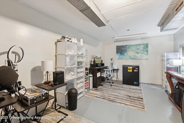 8713 Wintergreen St, Lansing, MI 48917 - home office featuring concrete floors