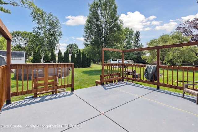 8713 Wintergreen St, Lansing, MI 48917 - fenced backyard with a patio area, a playground, and a storage shed