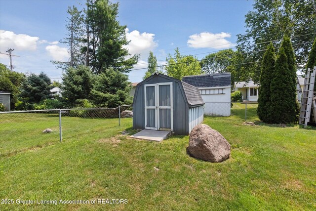 8713 Wintergreen St, Lansing, MI 48917 - fenced backyard featuring a storage shed