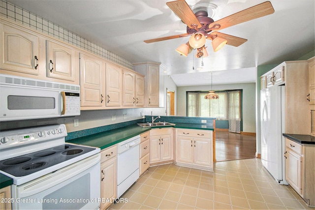 6875 W Howe Rd, Dewitt, MI 48820 - kitchen featuring white appliances, dark countertops, a peninsula, a ceiling fan, and light brown cabinetry