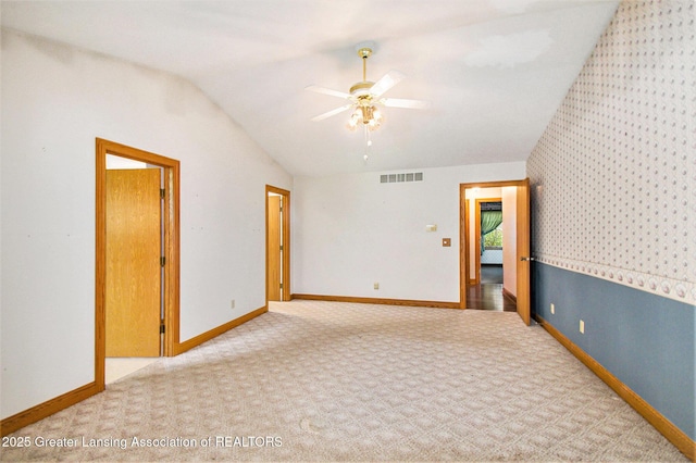 6875 W Howe Rd, Dewitt, MI 48820 - carpeted empty room with vaulted ceiling and ceiling fan