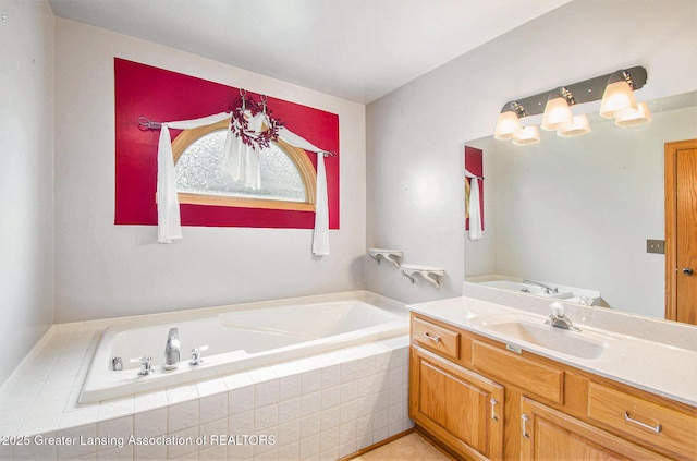6875 W Howe Rd, Dewitt, MI 48820 - bathroom featuring a garden tub and vanity