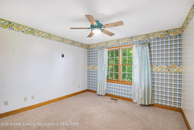 6875 W Howe Rd, Dewitt, MI 48820 - spare room featuring carpet flooring, ceiling fan, and wallpapered walls