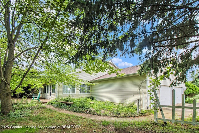 6875 W Howe Rd, Dewitt, MI 48820 - view of property exterior with driveway