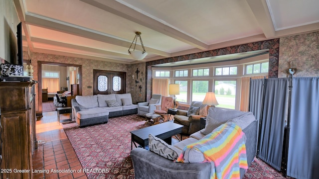 502 S Main St, Eaton Rapids, MI 48827 - living area with wallpapered walls, beamed ceiling, and tile patterned flooring