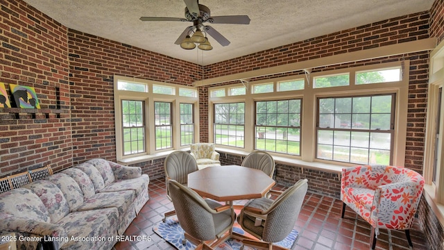 502 S Main St, Eaton Rapids, MI 48827 - sunroom with brick wall, a textured ceiling, a ceiling fan, an outdoor living space, and tile patterned floors