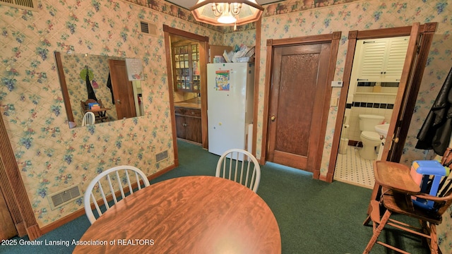 502 S Main St, Eaton Rapids, MI 48827 - carpeted dining room with wallpapered walls