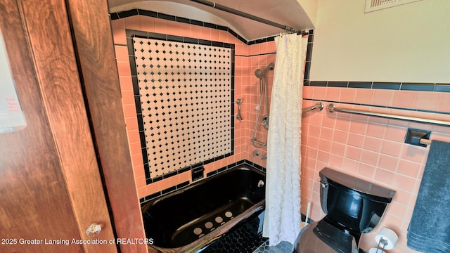 502 S Main St, Eaton Rapids, MI 48827 - full bath with tile walls and shower / bath combo with shower curtain
