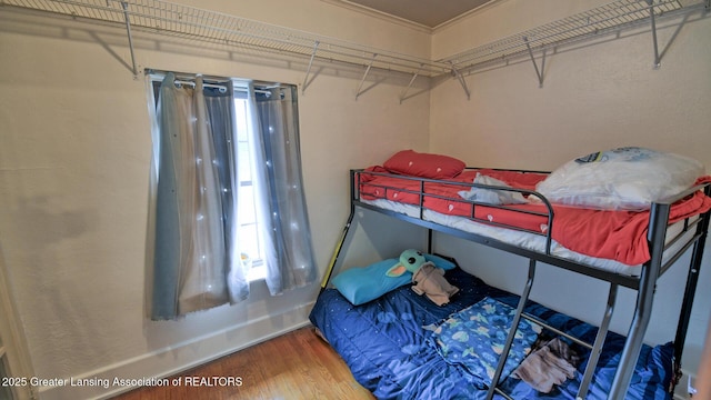 502 S Main St, Eaton Rapids, MI 48827 - bedroom featuring wood finished floors and crown molding