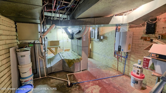 502 S Main St, Eaton Rapids, MI 48827 - unfinished below grade area featuring tankless water heater, electric panel, and brick wall