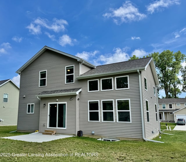 4314 Ringneck Ln, Holt, MI 48842 - rear view of house featuring entry steps, a lawn, and a shingled roof