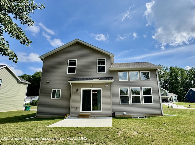 4314 Ringneck Ln, Holt, MI 48842 - rear view of house with a yard and a patio area