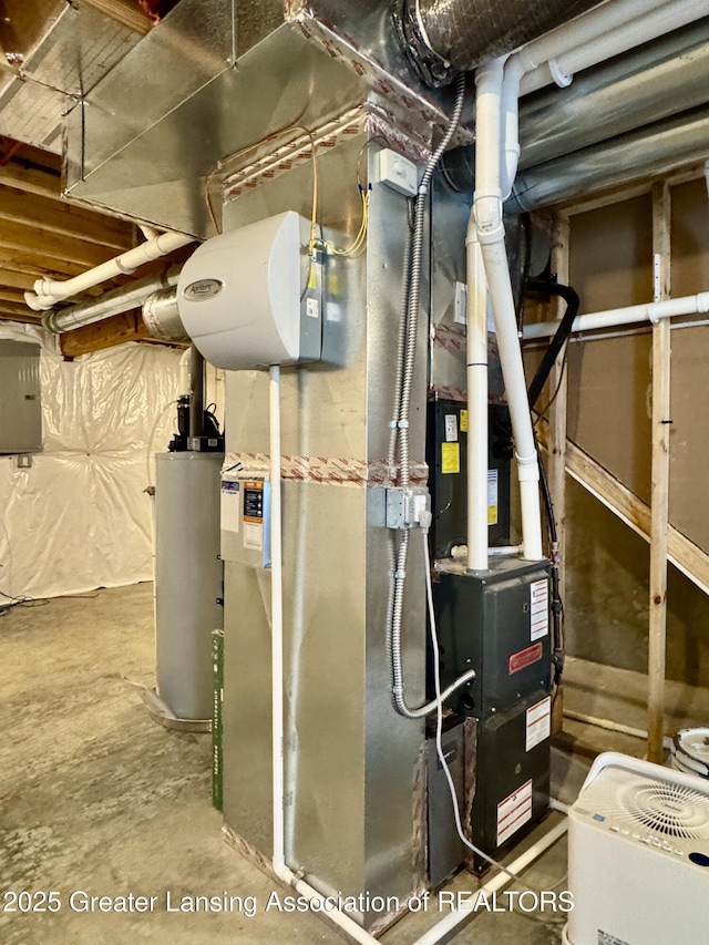 4314 Ringneck Ln, Holt, MI 48842 - utility room featuring gas water heater and electric panel