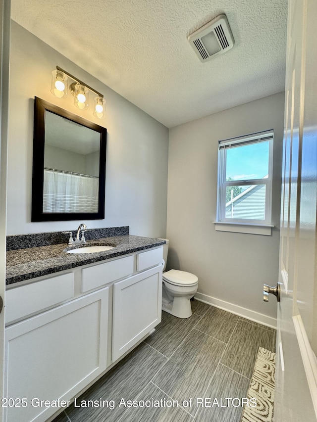 4314 Ringneck Ln, Holt, MI 48842 - full bath with vanity and a textured ceiling