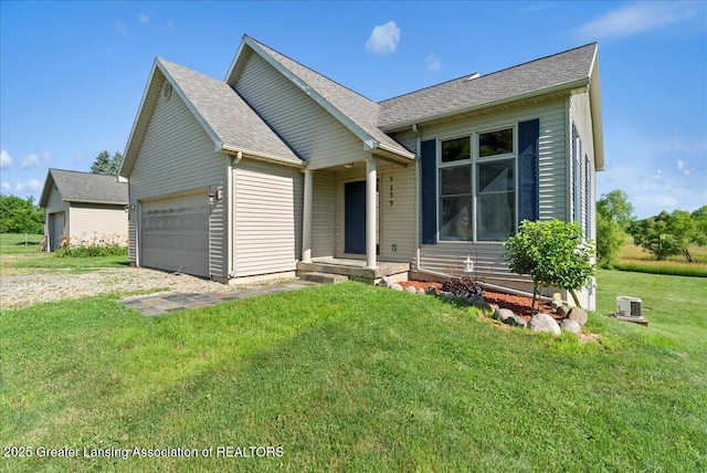 5159 E Pratt Rd, Saint Johns, MI 48879 - ranch-style home featuring an attached garage, a front lawn, a shingled roof, and driveway