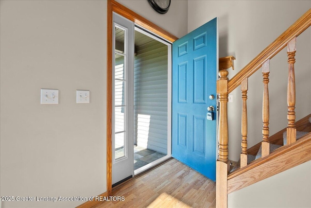 5159 E Pratt Rd, Saint Johns, MI 48879 - foyer entrance with wood finished floors, stairway, and healthy amount of natural light
