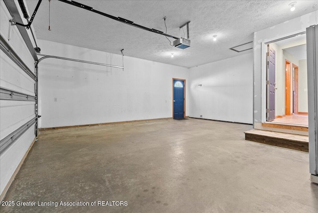 5159 E Pratt Rd, Saint Johns, MI 48879 - garage with a garage door opener and baseboards