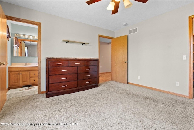5159 E Pratt Rd, Saint Johns, MI 48879 - bedroom featuring carpet, ensuite bath, and a ceiling fan