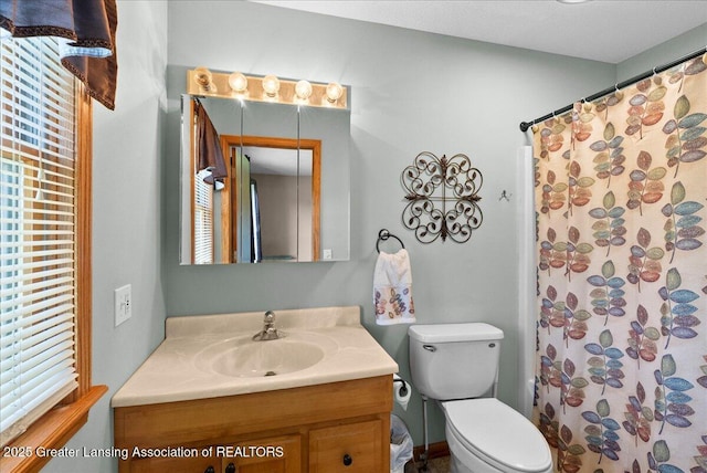 5159 E Pratt Rd, Saint Johns, MI 48879 - bathroom with vanity, a shower with shower curtain, and healthy amount of natural light