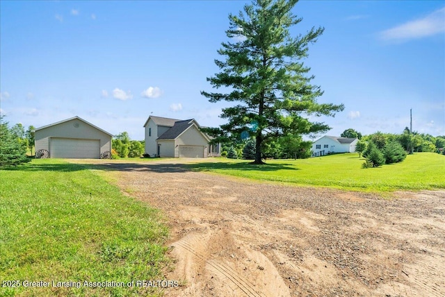 5159 E Pratt Rd, Saint Johns, MI 48879 - view of front of property featuring a detached garage and a front yard