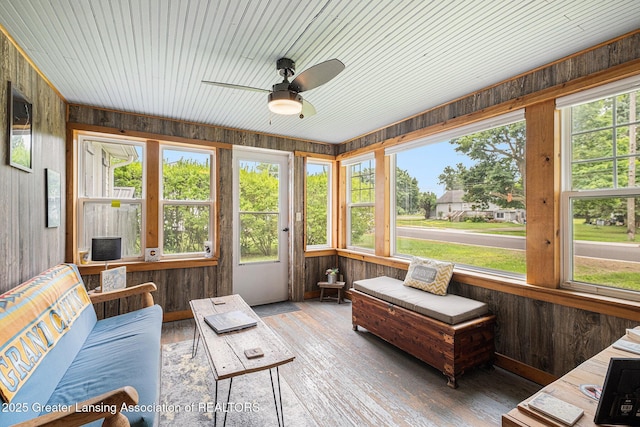 112 Ferry St, Corunna, MI 48817 - sunroom featuring wooden walls and hardwood / wood-style flooring