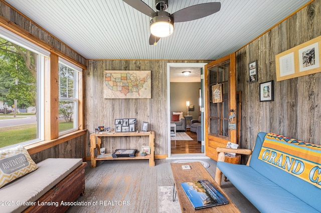 112 Ferry St, Corunna, MI 48817 - living area with wooden walls, wood finished floors, a ceiling fan, and wooden ceiling