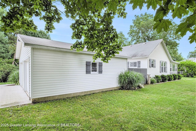 112 Ferry St, Corunna, MI 48817 - view of side of home featuring a garage and a yard
